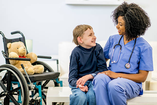 Nurse providing care to a child in a wheelchair